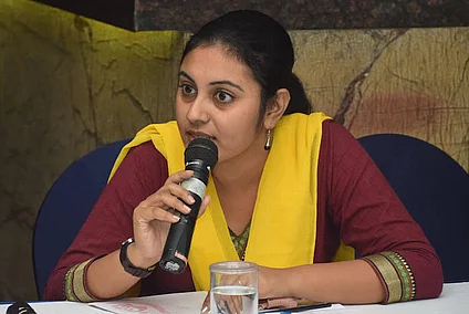 Young woman speaking into a microphone